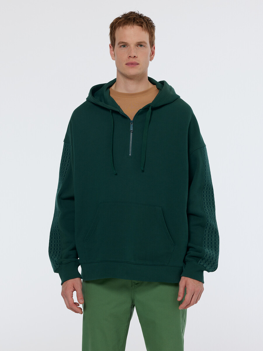 sudadera con capucha holgada con media cremallera y ribete de canalé